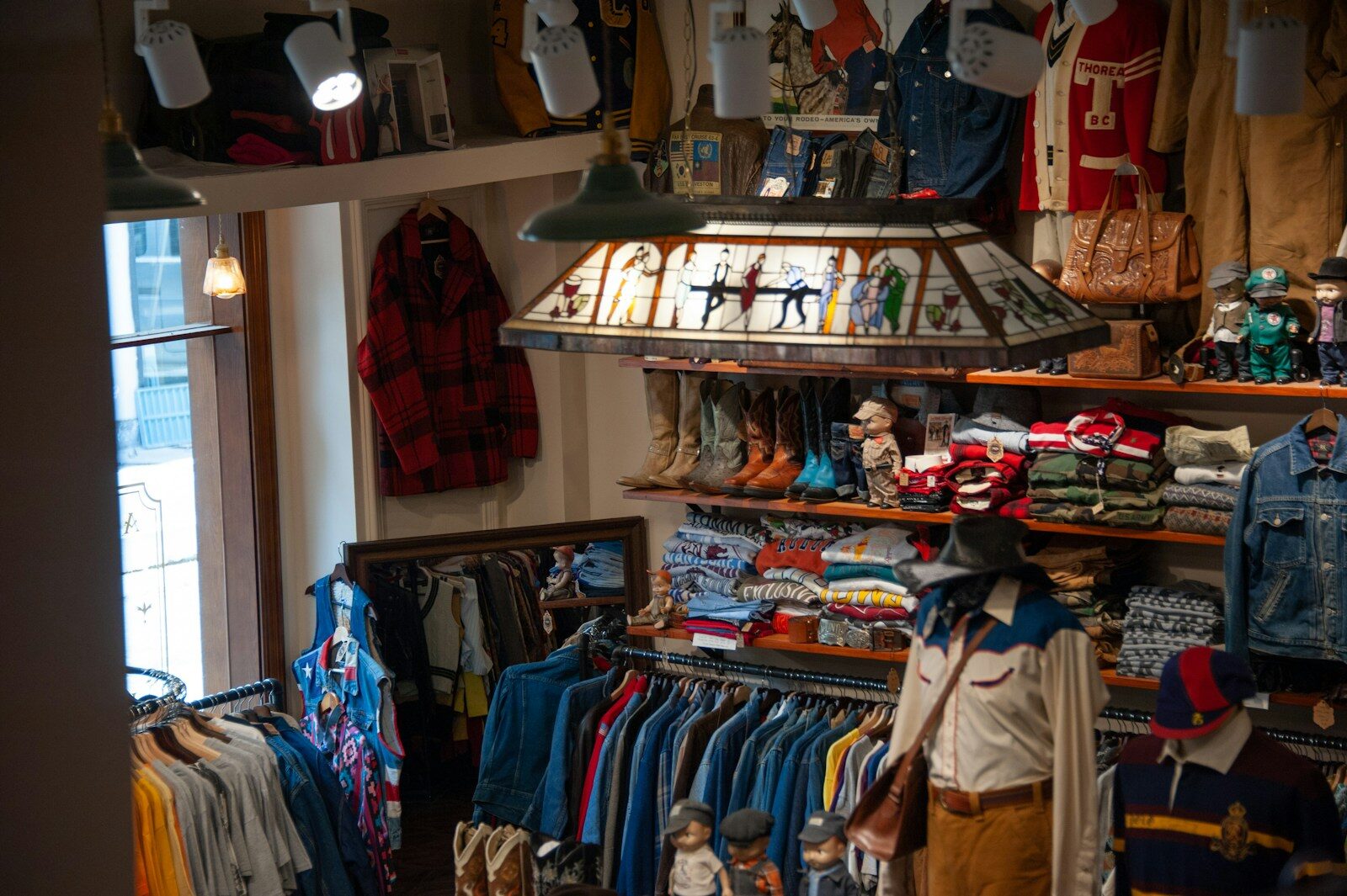 A clothing store with a lot of clothes on display